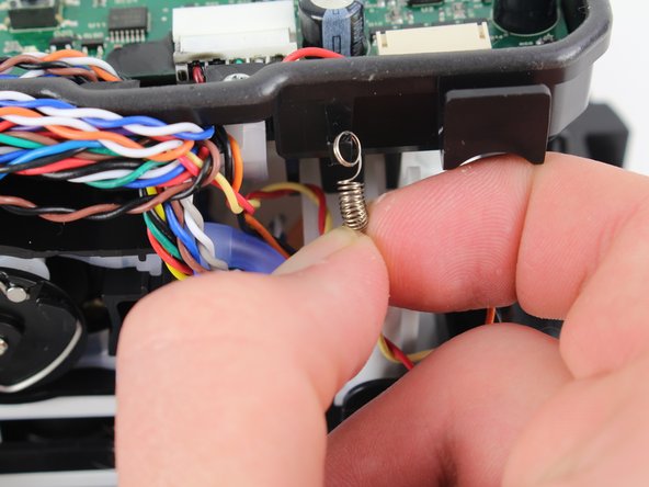 Remove the iRobot Braava Jet 240 Motherboard Case, Remove pad ejection lever spring: crwdns2935265:012crwdnd2935265:03crwdnd2935265:03crwdne2935265:0