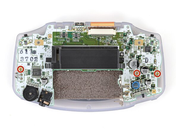 Game Boy Advance Speaker Replacement, Remove the motherboard screws: crwdns2935265:011crwdnd2935265:01crwdnd2935265:02crwdne2935265:0