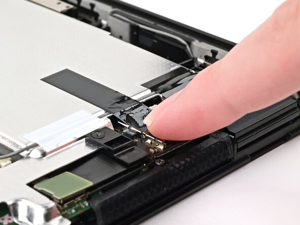 Nintendo Switch 2 MicroSD Card Reader Replacement, Press down the tape: crwdns2935265:031crwdnd2935265:02crwdnd2935265:02crwdne2935265:0