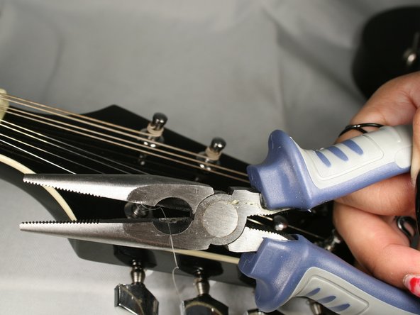 How to Replace the Strings on your Rogue RM-100A A-Style Mandolin: step 8, image 1 of 1