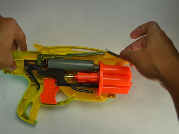 Air Blasters Tek Six Reload Slider Spring Replacement, Remove screw holding the top spring to reload slider: crwdns2935265:05crwdnd2935265:02crwdnd2935265:02crwdne2935265:0