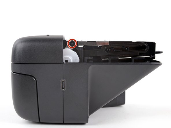 Polaroid Flip Film Door Replacement, Remove the film door screws: crwdns2935265:06crwdnd2935265:02crwdnd2935265:02crwdne2935265:0