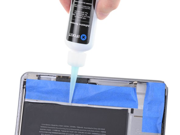 iPad Pro 9.7" Battery Replacement, Apply adhesive remover to the top of the battery: step 116, image 2 of 3