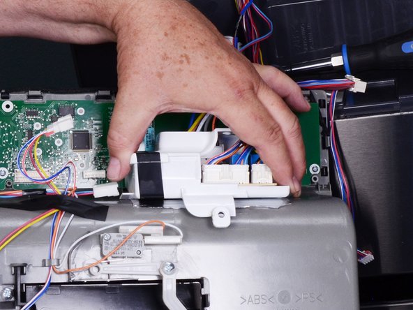 LG Refrigerator Water Dispensing Switch Testing and Replacement, Unfasten the circuit board holder: crwdns2935265:010crwdnd2935265:02crwdnd2935265:03crwdne2935265:0