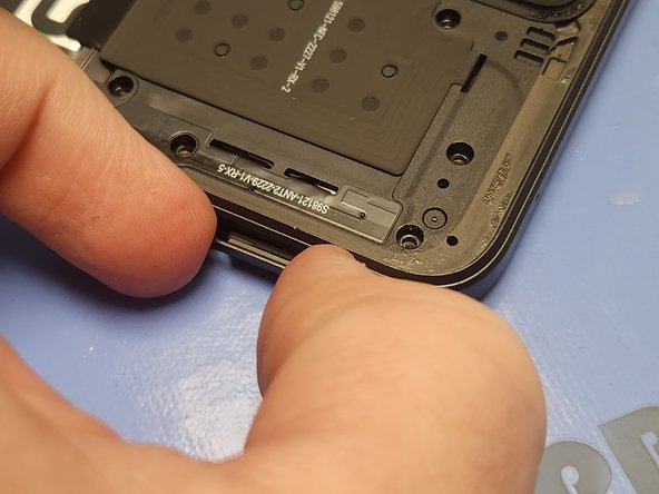 Revvl 6 Pro 5G Screen Replacement, Remove the Sim Card Tray: crwdns2935265:012crwdnd2935265:02crwdnd2935265:03crwdne2935265:0