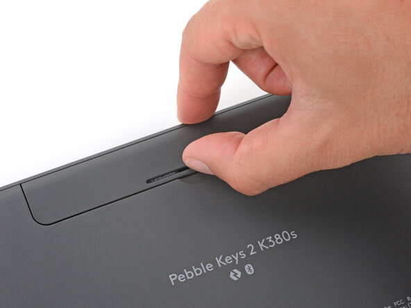 How to Open Your Logitech Pebble Keys 2 K380s Keyboard, Remove the battery cover: passo 2, immagine 1 di 3