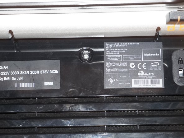 Full method - HP Touchsmart IQ506 CMOS Battery Replacement, Remove the RAM door: crwdns2935265:04crwdnd2935265:02crwdnd2935265:03crwdne2935265:0