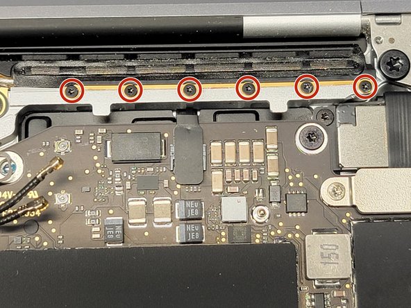 MacBook Pro 13" Two Thunderbolt Ports 2020 Touchbar Removal, Removing Antenna Screws: crwdns2935265:019crwdnd2935265:03crwdnd2935265:03crwdne2935265:0