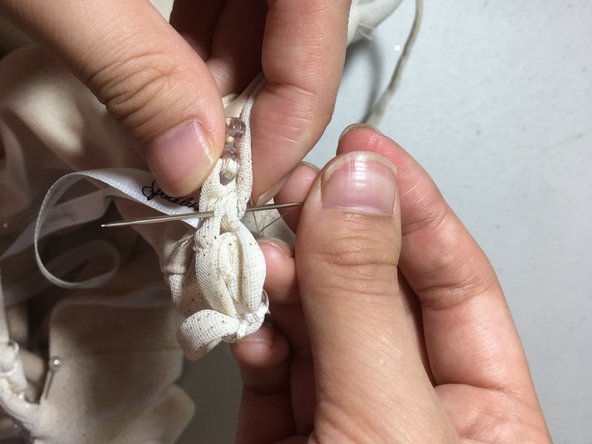 How to sew a detached strap to a dress: step 14, image 1 of 2