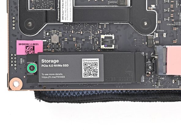 How to Install a Framework Desktop Mainboard Into a Mini‑ITX Case, Loosen the secondary storage screw: step 2, image 1 of 2