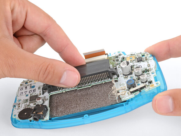 How to Reshell Your Game Boy Advance, Insert the motherboard: crwdns2935265:026crwdnd2935265:02crwdnd2935265:03crwdne2935265:0