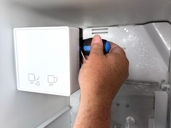 Frigidaire Side-By-Side Refrigerator Evaporator Fan Cover Removal, Unfasten the ice maker: crwdns2935265:03crwdnd2935265:03crwdnd2935265:03crwdne2935265:0