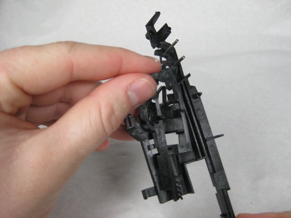 Remove the two loose plastic pieces.