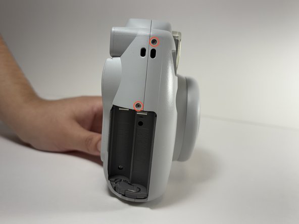 Fujifilm Instax Mini 9 Flash Capacitor Replacement, Remove Shell Screws: crwdns2935265:04crwdnd2935265:03crwdnd2935265:03crwdne2935265:0