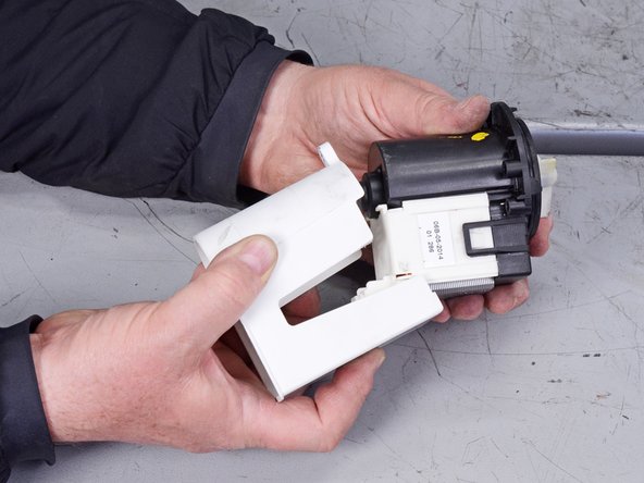 LG Front Load Washing Machine Drain Pump Motor Replacement, Remove the pump housing: crwdns2935265:042crwdnd2935265:03crwdnd2935265:03crwdne2935265:0