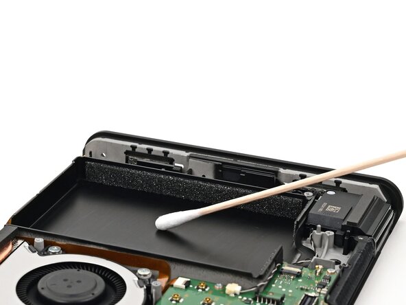 Nintendo Switch 2 Battery Replacement, Clean the battery well: crwdns2935265:038crwdnd2935265:02crwdnd2935265:02crwdne2935265:0