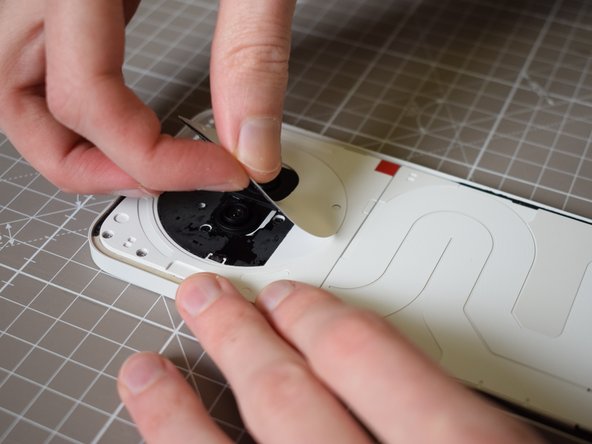Nothing Phone (2a) Battery Replacement, Remove the sticker surrounding the camera unit: crwdns2935265:03crwdnd2935265:03crwdnd2935265:03crwdne2935265:0