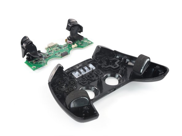 SteelSeries Nimbus+ Triggers Replacement, Lift up the mainboard: crwdns2935265:015crwdnd2935265:03crwdnd2935265:03crwdne2935265:0