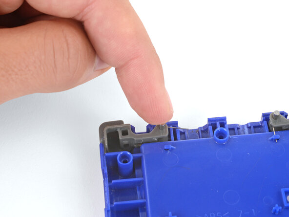 How to Install Shoulder Buttons in Your Game Boy Advance SP, Put the shoulder button in place: crwdns2935265:03crwdnd2935265:03crwdnd2935265:03crwdne2935265:0