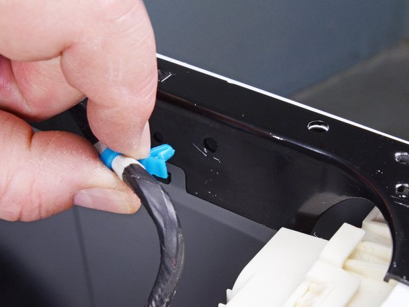 LG Front Load Washing Machine Detergent Dispenser Replacement, Unclip the control panel cable: crwdns2935265:08crwdnd2935265:03crwdnd2935265:03crwdne2935265:0