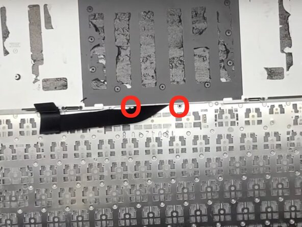 MacBook Pro 15" Retina Display Mid 2015 keyboard Replacement, Remove the 2 screws: crwdns2935265:03crwdnd2935265:02crwdnd2935265:02crwdne2935265:0