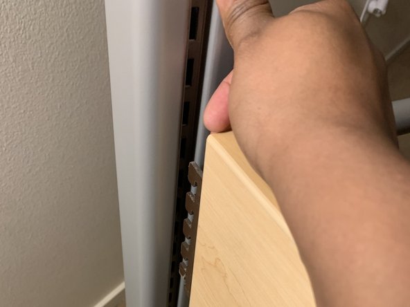 How to Un-loft a College Dorm Bed: step 2, image 2 of 3