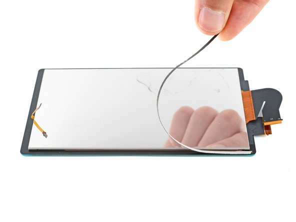 How to Replace the Screen Adhesive on Your Switch Lite, Apply the adhesive: crwdns2935265:04crwdnd2935265:02crwdnd2935265:03crwdne2935265:0