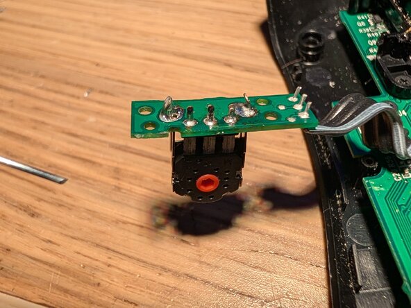 Replacing the scroll wheel encoder on the Logitech G403 Wired, Clean up and new sensor: step 6, image 3 of 3