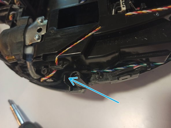 Ecovacs Deebot 920 Reassembly, Installing The Right Wheel Well (cont.): crwdns2935265:08crwdnd2935265:03crwdnd2935265:03crwdne2935265:0