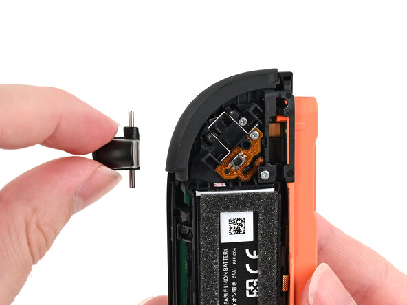 Joy-Con 2 (Right) Joystick Replacement, Remove the release button: crwdns2935265:013crwdnd2935265:02crwdnd2935265:02crwdne2935265:0