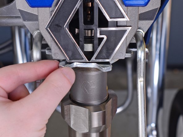 You may need to use a mallet to gently tap on the nut's teeth to loosen it.