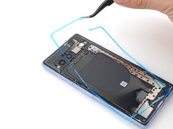How to Apply Rear Cover Adhesive in Your Google Pixel 7a, Remove the liners: crwdns2935265:010crwdnd2935265:03crwdnd2935265:03crwdne2935265:0