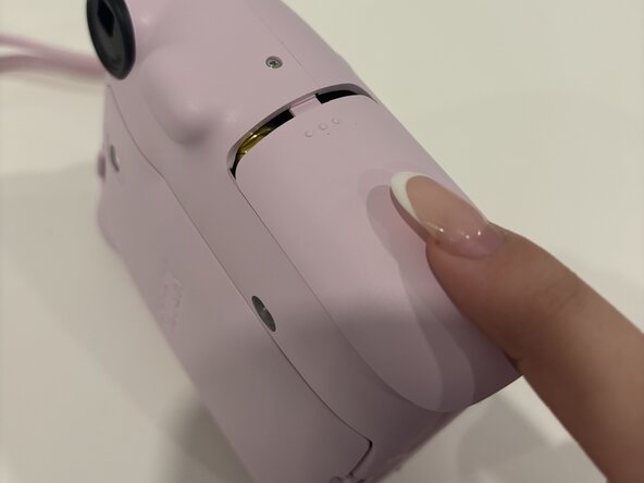 Replacing the Batteries on a Fujifilm Instax Mini 12: adım 5, 2 resimden 2.
