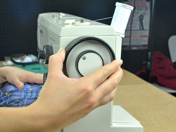 Only turn the balance wheel in the direction that advances the machine. Turning the wheel the opposite direction can cause tangling or ruin the tension on the machine.