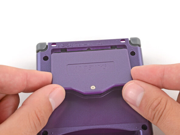 How to Reshell Your Game Boy Advance SP, Install the battery cover: crwdns2935265:067crwdnd2935265:01crwdnd2935265:03crwdne2935265:0