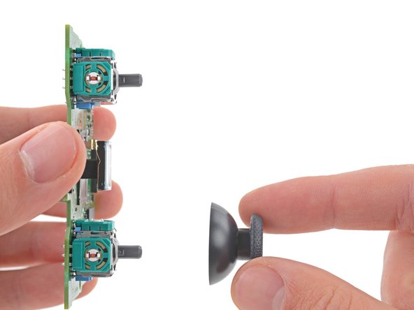 DualSense Controller v2 Joystick Replacement, Remove the joystick covers: crwdns2935265:027crwdnd2935265:03crwdnd2935265:03crwdne2935265:0