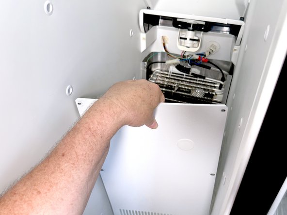 Frigidaire Side-By-Side Refrigerator Evaporator Fan Cover Removal, Remove the lower evaporator cover: crwdns2935265:016crwdnd2935265:03crwdnd2935265:03crwdne2935265:0