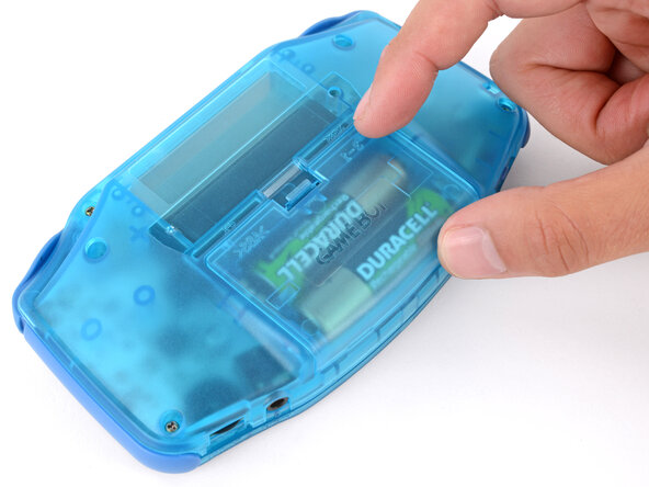How to Reshell Your Game Boy Advance, Install the battery cover: crwdns2935265:037crwdnd2935265:02crwdnd2935265:02crwdne2935265:0