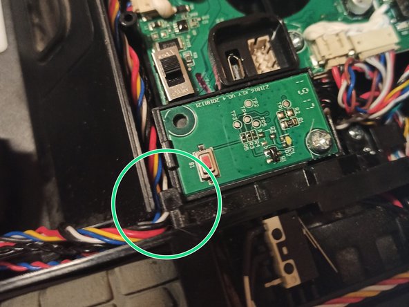 Ecovacs Deebot 920 Reassembly, Installing The Right Wheel Well (cont.): crwdns2935265:08crwdnd2935265:02crwdnd2935265:03crwdne2935265:0