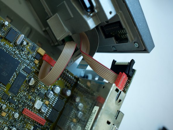 Porsche 997.1 PCM 2.1 Screen Replacement, Prying the facia away from the chassis: step 9, image 3 of 3