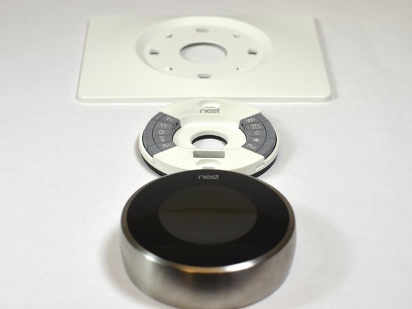 Nest Learning Thermostat 2nd Generation Base Motherboard Replacement, Remove base from trim plate: crwdns2935265:04crwdnd2935265:03crwdnd2935265:03crwdne2935265:0