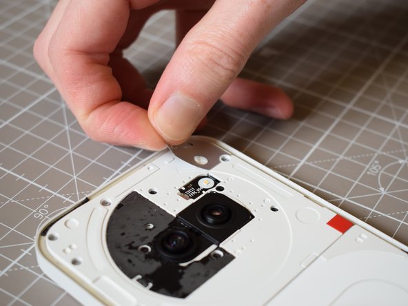 Nothing Phone (2a) Battery Replacement, Remove silver sticker in the top right: crwdns2935265:04crwdnd2935265:02crwdnd2935265:02crwdne2935265:0