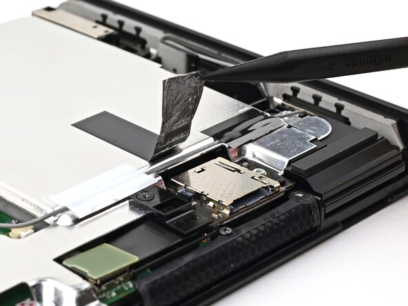 Nintendo Switch 2 MicroSD Card Reader Replacement, Lift the tape: crwdns2935265:020crwdnd2935265:03crwdnd2935265:03crwdne2935265:0