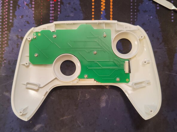 Disassembling 8BitDo Ultimate Bluetooth Controller, Detatch the ribbon cable: crwdns2935265:03crwdnd2935265:03crwdnd2935265:03crwdne2935265:0