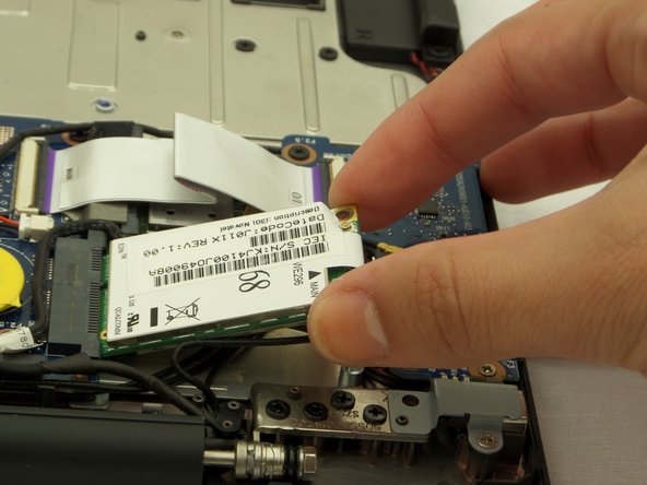 Cr-48 Chromebook Network Card Replacement, Unscrew and Remove Network Card: crwdns2935265:06crwdnd2935265:03crwdnd2935265:03crwdne2935265:0