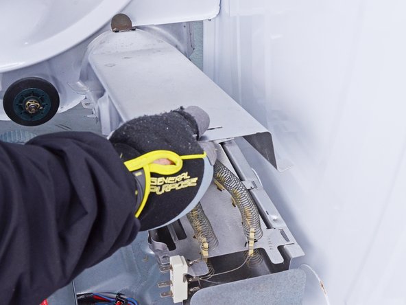 Whirlpool WED87HED Dryer Heating Element Testing and Replacement, Remove the heater housing cover: crwdns2935265:055crwdnd2935265:03crwdnd2935265:03crwdne2935265:0