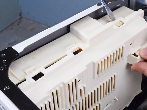 LG Front Load Washing Machine Main Board Replacement, Remove the main board cover: crwdns2935265:011crwdnd2935265:03crwdnd2935265:03crwdne2935265:0