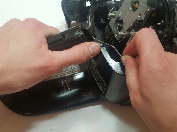 Disconnect the linkage from the throttle trigger