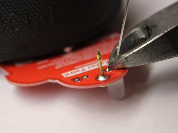Learn to solder electronics with the Maker Shed Solder Badge!, Continue soldering the LED in place.: crwdns2935265:020crwdnd2935265:03crwdnd2935265:03crwdne2935265:0
