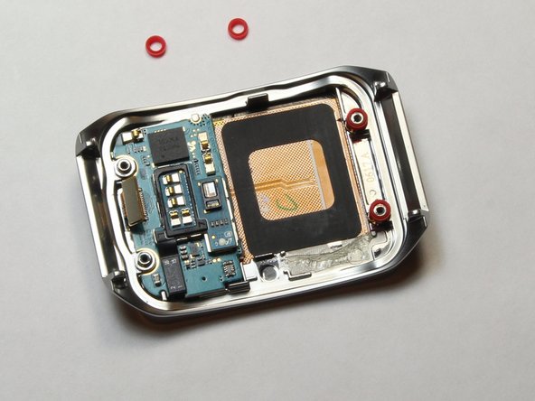 Samsung Gear Live Motherboard Replacement, Remove the red spacers: crwdns2935265:010crwdnd2935265:02crwdnd2935265:02crwdne2935265:0